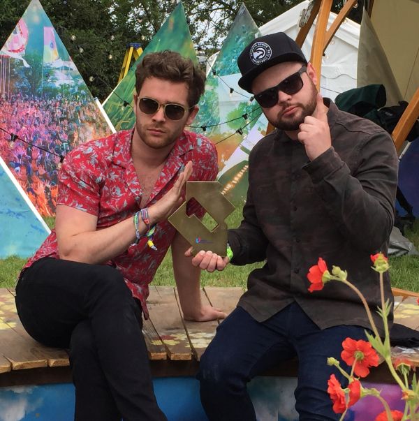 Royal Blood are presented with their Official Number 1 Album Award ahead of their set at Glastonbury Festival. Pic credit: OfficialCharts.com